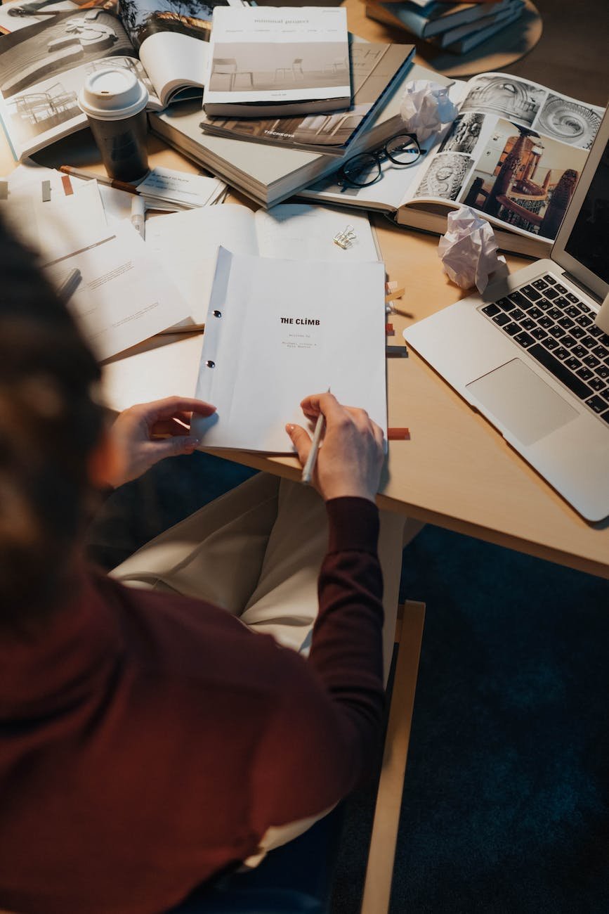 person holding white printer paper